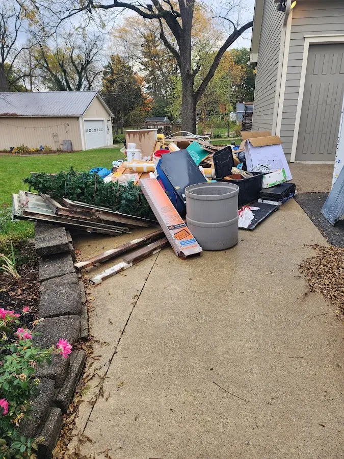 Dumpster being loaded with debris for Demolition Dumpster Rental in Dallas